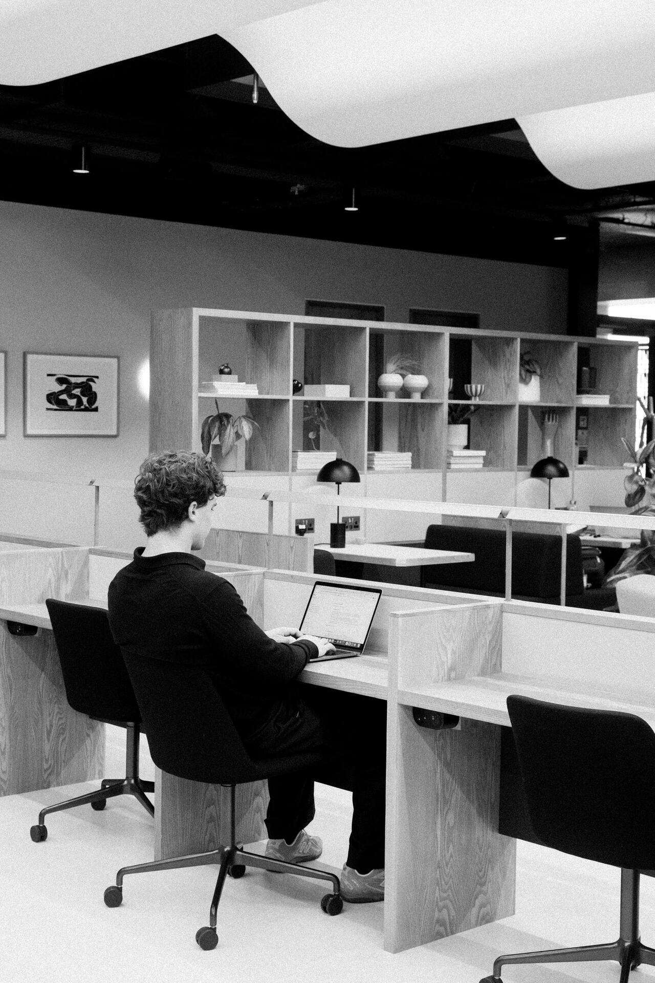 A member of a finance team working through the books at a quiet desk
