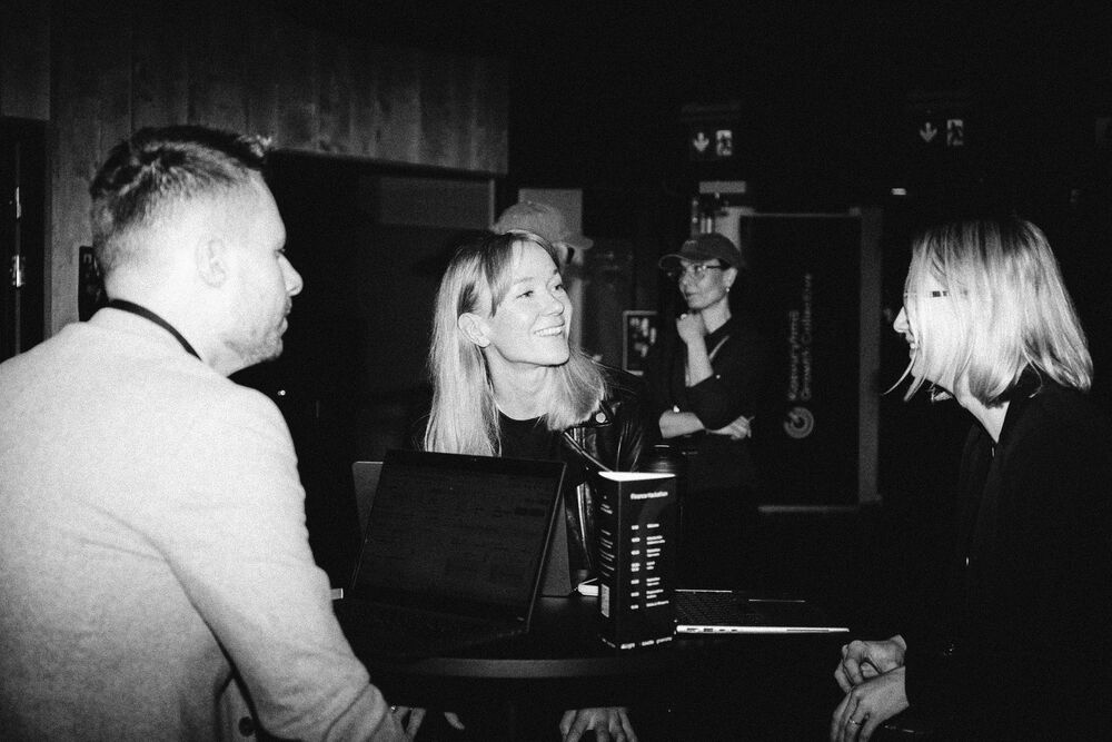 Guests talking at a Light event