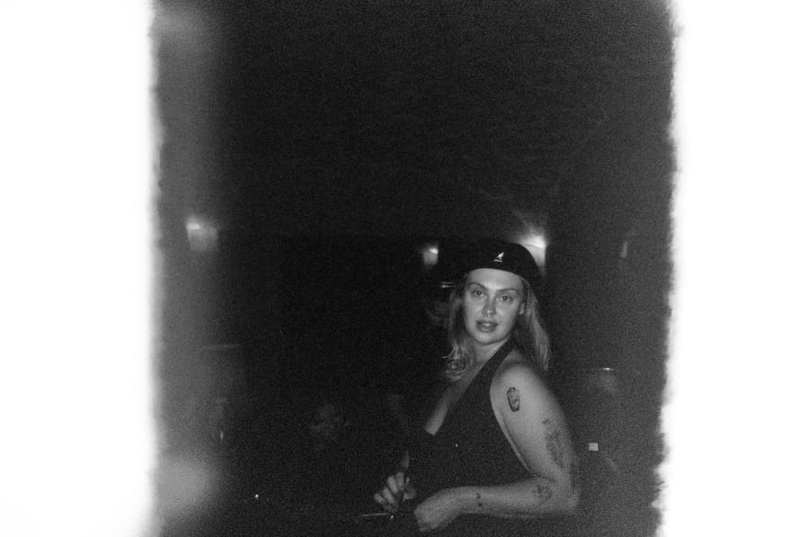 A teammate glancing back at the camera in a dimly lit room