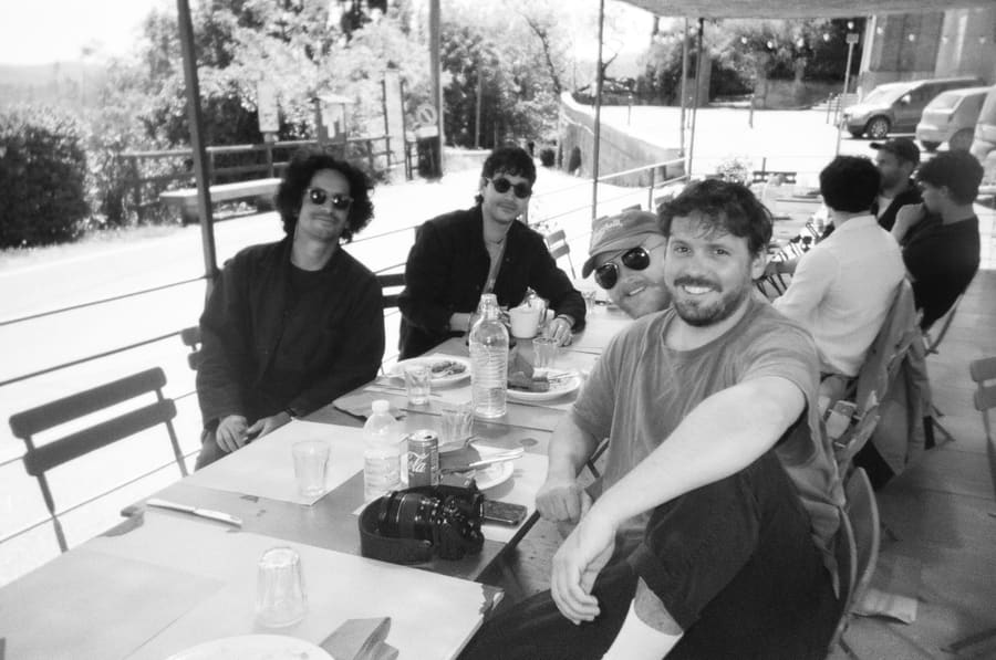 Teammates having lunch together at an outdoor table